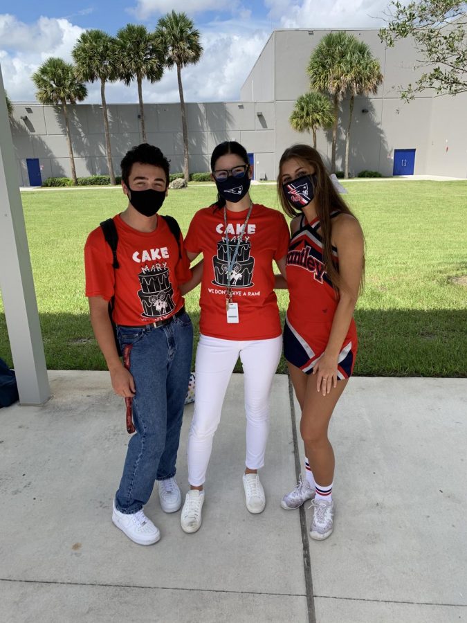 Student Body President and Vice President Ike Schiller and Tess Trimble along with Ms. Audra Greuel showing their school spirit wearing their Beat Lake Mary t-shirts.
