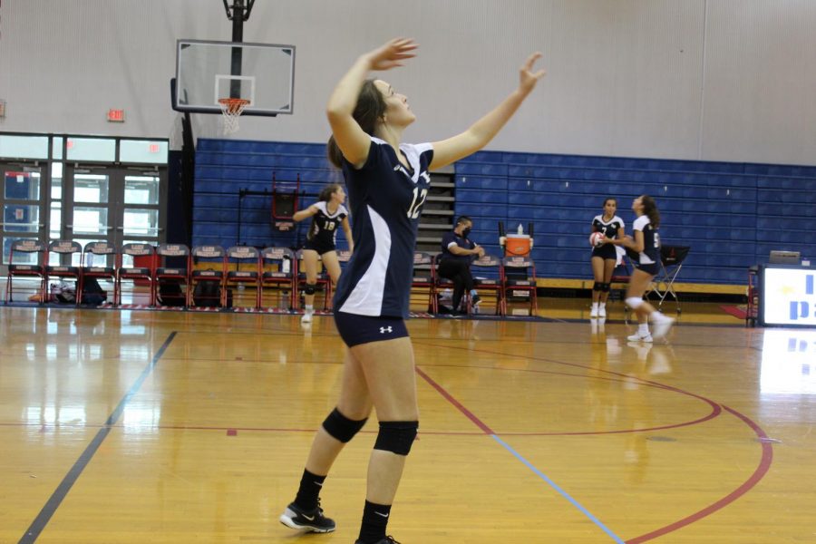 Sophomore+Mayson+Cooney+prepares+to+spike+the+ball+while+warming+up+for+the+Junior+Varsity+volleyball+game+against+Seminole+High+School+on+Thursday%2C+Sept.+10.