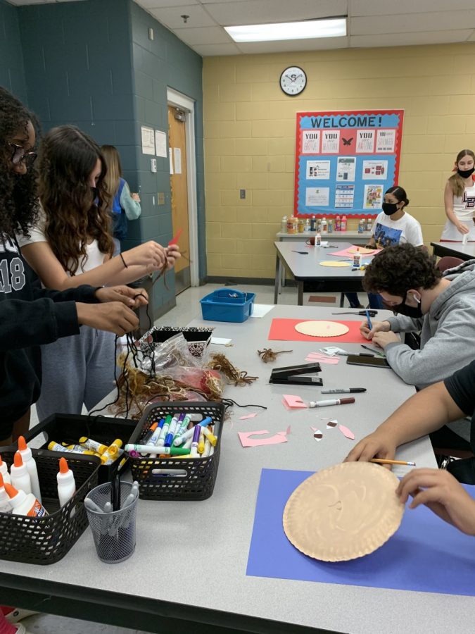 This week’s project was to make a paper-plate portrait of themselves. Students start this project by gathering materials to mather their hair color, eye color, as well as blending colors to match their skin tone.