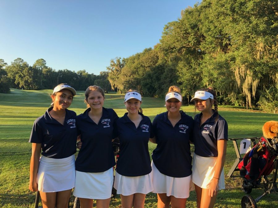 On Monday, Oct. 19, members of the girls’ golf team pose in the fairway section of the course in Gainesville, FL. The players had a great season and made it all the way to regional finals. The girls remain hopeful that they will have an even better season next year.