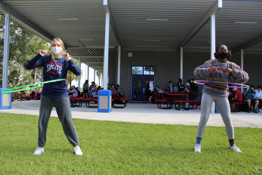 Junior Abigail Ripple and senior Tyla Hall go head to head in a hula hoop competition at C lunch on Tuesday, Nov. 3. Hall outlasted Ripple, resulting in a win for the senior class. “Being able to hula hoop the senior class to victory was the best moment of my life,” Hall said. 