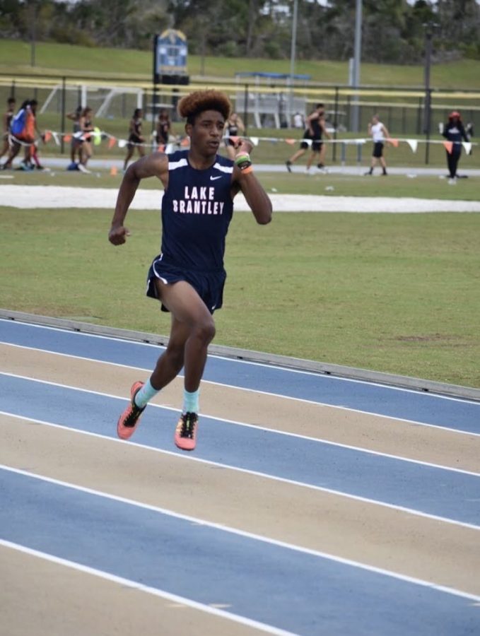 Senior Chadrick Richards competes in the 200 meter event at the districts gathering at Embry-Riddle Aeronautical University on April 10, 2019. “His work ethic from on the field to off the track is just great,” junior Relamp Ramirez said. “He is a good student and leader, and is always going on runs and workouts when not on the track, he is always putting in that extra work.”