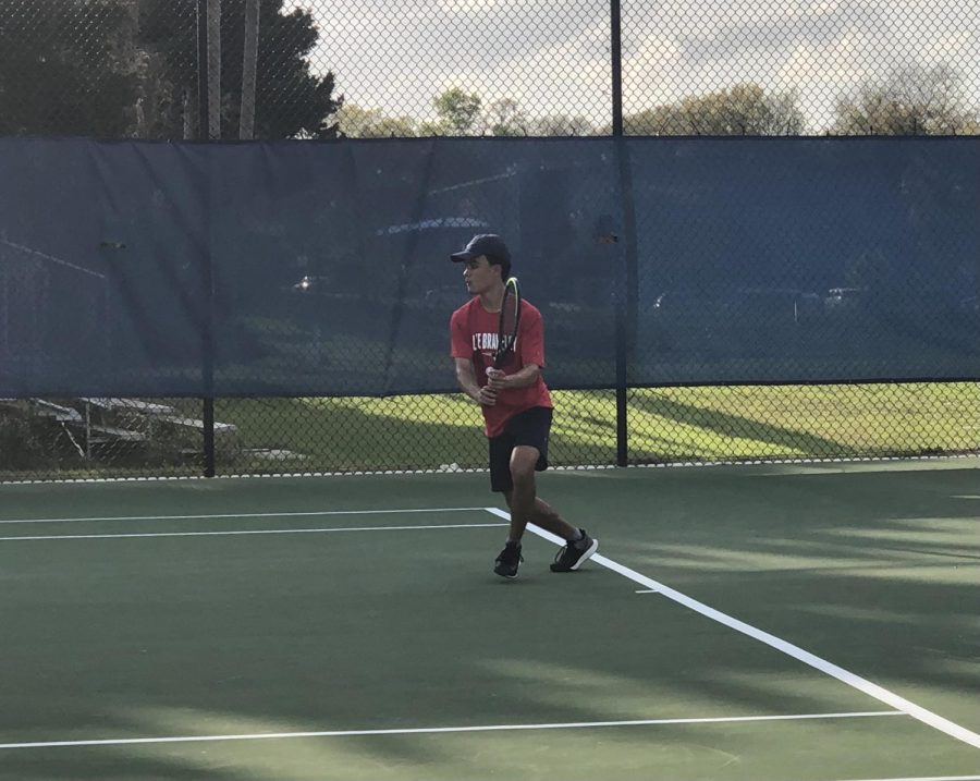 Sophomore Dean Scornik plays singles against Apopka High School. “My favorite part of tennis is the mental aspect and its individuality, Scornik said. Tennis is a sport where you often have to rely on yourself and your mental strength in order to win tough matches.
