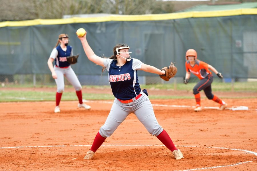 Tuesday, Feb. 16, junior pitcher Christina Norberg stands on the pitcher’s mound during a game against University High School. With an opponent on first base, Norberg winds up to pitch. Despite their efforts, the JV girls’ fast pitch softball team fell to University High School 3-13.