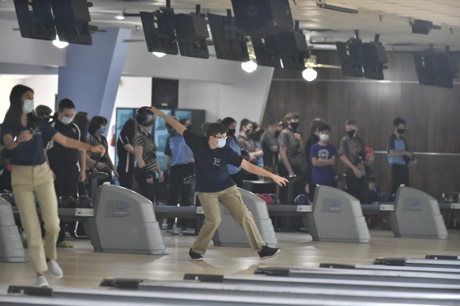 With his teammates looking on, freshman Zachary Kanaga focuses while preparing to release the bowling ball. The boys’ bowling team came on top against Seminole High School on Wednesday, Sept. 23. The match ended with a final score of 1803-724 and freshman Caden Hill led with a 376 series.