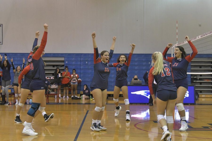 On Wednesday, Oct. 21, the varsity girls’ volleyball team played a regional game against Apopka High School. Junior Mya Mendoza and teammates celebrate on the court after scoring a point. The varsity girls’ volleyball team beat Apopka High School 3-0.