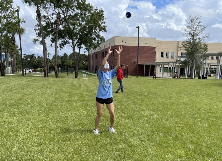 Junior Rebecca Montanez attempts to catch a football at the Lunch Jam pep rally on Friday, Aug. 13. “We’re having so much fun and I love showing off my school spirit,” Montanez said. “To get involved, I go to the sports games, join clubs and participate in events like this. It brings everybody together.”