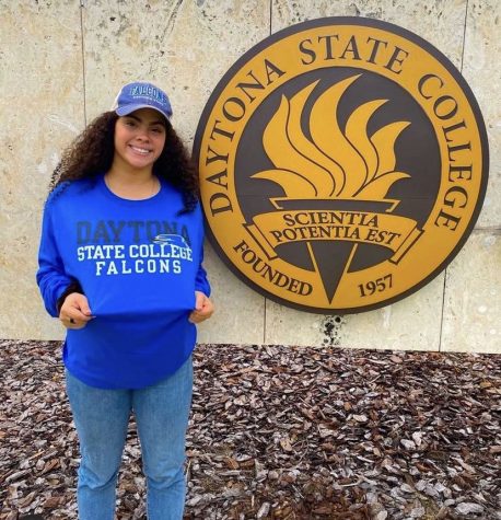 Senior Mya Mendoza poses in front of the welcome sign for Daytona State College, where she has recently announced her commitment to.