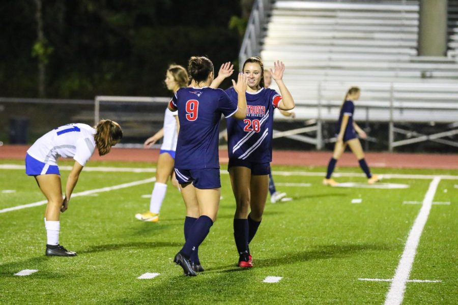 On top of a spur of recent victories, the girls varsity soccer team is in great condition after beating Lyman High School 5-2. Having previously tied against the school and eager for a win, the team was full of energy before, during, and after the intense game.