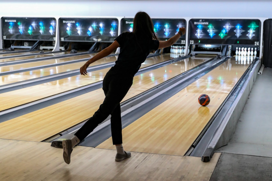 On Aug. 29, junior Bridget Mead rolls her bowling ball down the lane in an attempt to earn a strike. The match took place at Oviedo Lanes against Lake Howell High School, the Patriots eventually emerging victorious. 