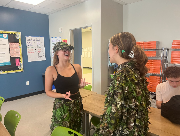 On Tuesday, Sept. 13, seniors Samantha Harper and Rebecca Montanez dress in camouflage for the spirit day. “I decided to dress up because this guy gave me this camo suit and I thought it was really cool looking,” Harper said. “I’m a senior and I wanted to go all out for spirit week this year.”