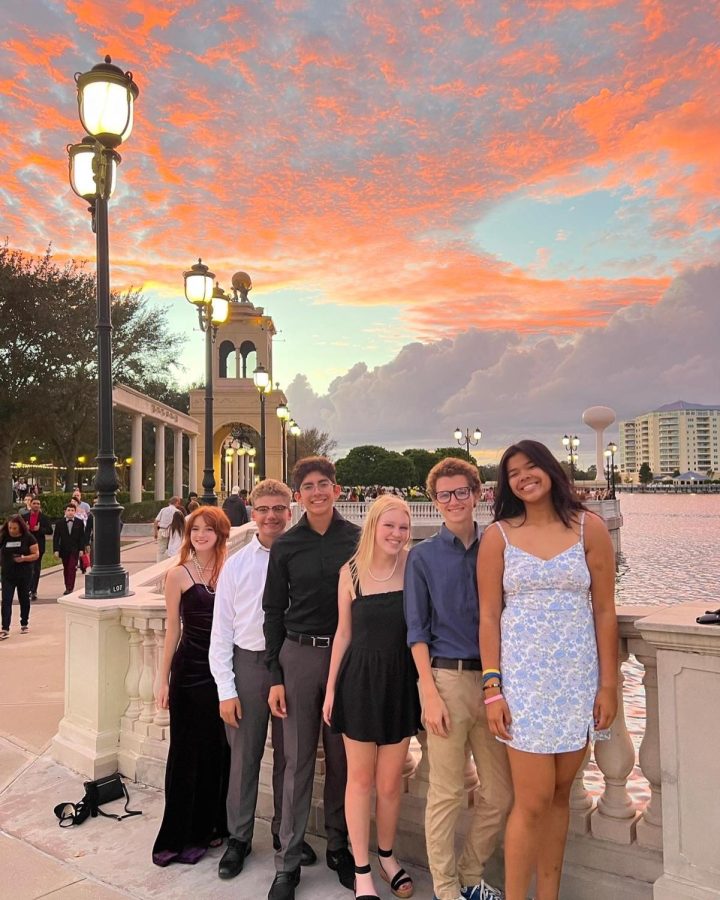 On Oct. 29 at Cranes Roost Park, senior Julia Hubbell and friends pose in their homecoming attire. Despite dressing up for the occasion, the group opted to go out to eat instead of going to the dance. 