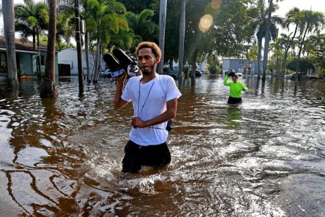 A resident of Fort Lauderdale Florida leaving his house after three days of flooding, the entire neighborhood is still unlivable. 