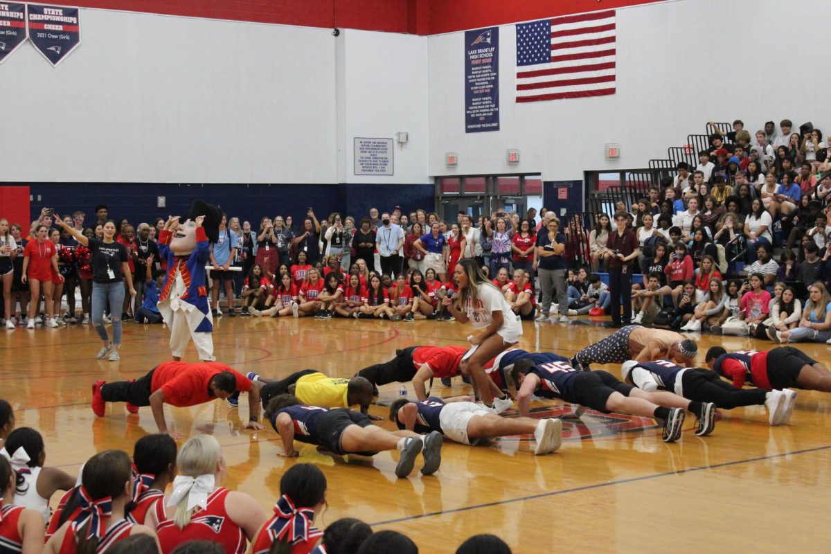 Senior Aulani Irby led the staff versus football player push up contest to give students and teachers a chance to cheer on players before the big game. “I feel like the pep rally was very hype,” Irby said. “It was an amazing first pep rally, but we’ll make the games run faster next time.” 