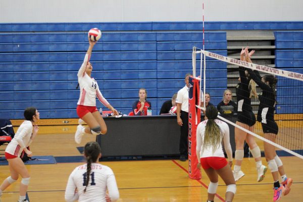 Senior Samantha Bowron hits the ball over the net during a game. 